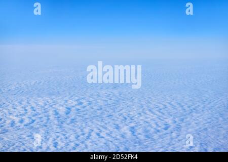 background, cloudscape - continuous cirrocumulus clouds, top view, from an airplane or from space Stock Photo