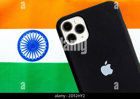 Calgary, Alberta, Canada. Oct 12, 2020. An India flag with an Apple iPhone Pro Max. Concept: Apple manufacturing products in india. Stock Photo