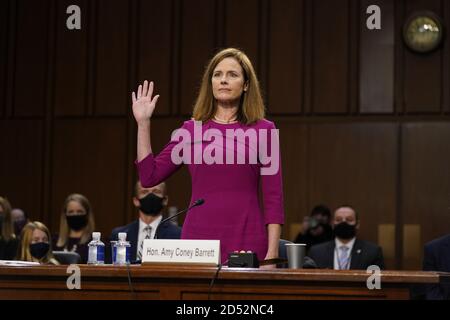 Washington, United States. 12th Oct, 2020. Supreme Court nominee Judge Amy Coney Barrett is sworn in during her confirmation hearing before the Senate Judiciary Committee, on Capitol Hill in Washington, DC, Monday, October 12, 2020. The hearings are expected to last four days. If confirmed, Barrett will replace Justice Ruth Bader Ginsburg, who died last month. Pool photo by Patrick Semansky/UPI Credit: UPI/Alamy Live News Stock Photo