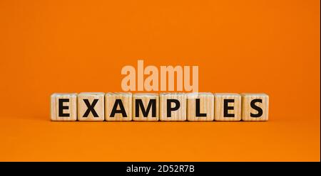 Concept word 'examples' on cubes on a beautiful orange background. Business concept. Copy space. Stock Photo