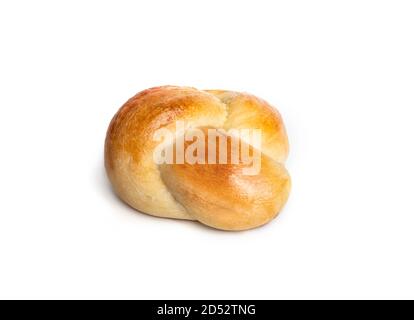 Single yeast bread bun in perspective view. One baked braided yeast knot roll with egg wash. Traditional Swiss butter bread called Zopf or Challah. Stock Photo
