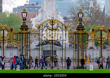 tourist at the golden and black colored iron Canada gate and victoria memorial in London, United Kingdom Stock Photo