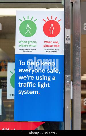 Signage seen at the Tesco metro supermarket in Dean Street, which has a traffic light system to let shoppers know when it is safe to enter the store so it can adhere to social distancing restrictions. Stock Photo