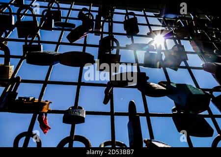 Lover lock on the bridge silhouette, Stock Photo