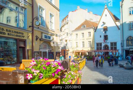 TALLINN, ESTONIA - JULY 14, 2019: People walking by sunny Old Town street view in Tallinn, Estonia Stock Photo