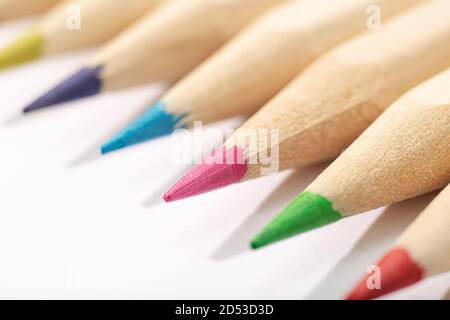 Macro shot of Wooden Colored pencils isolated on white background. Copy space Stock Photo
