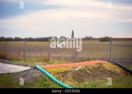 Offroad RC buggy driving on an outdoor dirt track Stock Photo