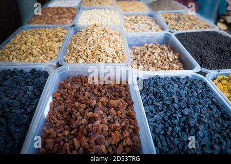 Dried berries on the counter. Raisins, dried prunes. Vegan food. healthy food. Selective focus. Stock Photo
