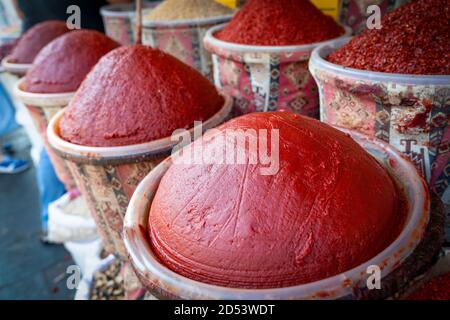 Tomato paste sold in kilograms  at the market. Stock Photo