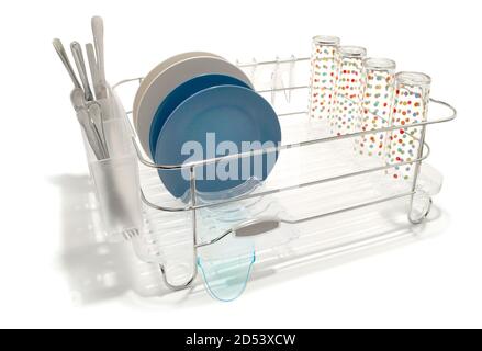 metal dish rack with plastic tray and dishes photographed on a white background Stock Photo