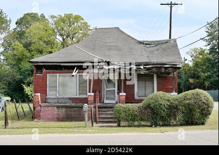 Vacant, empty or abandoned house or home in a poor area showing the level of poverty in the inner urban area of Montgomery Alabama, USA. Stock Photo