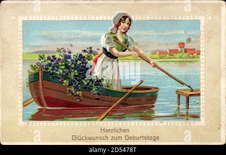 Glückwunsch Geburtstag, Junge Frau in Tracht im Boot mit Blumen | usage worldwide Stock Photo