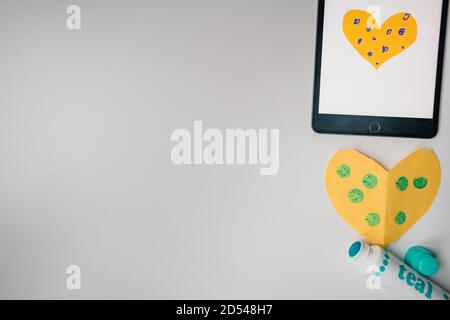 flat lay arrangement of craft activity supplies with tablet Stock Photo