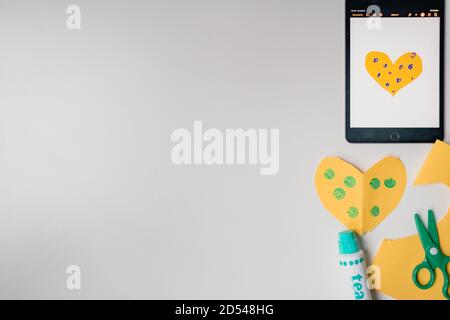 paint, scissors, paper, and tablet on white background Stock Photo