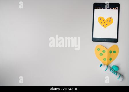 distance learning craft assignment supplies on desk Stock Photo