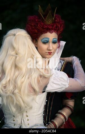 MUNICH, GERMANY - Sep 12, 2020: Cosplayer as characters from Alice in Wonderland. The red queen and white queen together Stock Photo