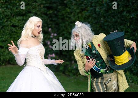 MUNICH, GERMANY - Sep 12, 2020: Cosplayer as characters from Alice in Wonderland. Tea party with Alice, the crazy hatter and the white queen Stock Photo