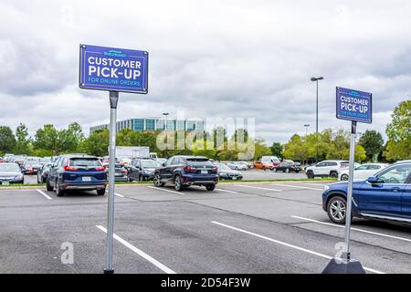 Sterling, USA - September 12, 2020: World Market parking lot store sign by entrance of store in Loudoun county, Virginia for customer pick-up with car Stock Photo