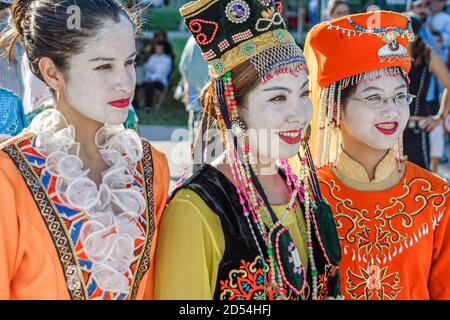 Miami Florida,Bayfront Park Hong Kong Dragon Boat Race Festival,Asians woman female women teen teens teenagers female outfit costume regalia,wears wea Stock Photo