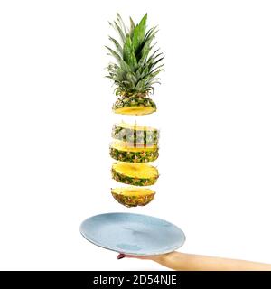 Pineapple fresh ananas. Pineapple sliced, levitates in the air. Concept of summer mood on white background, isolate. Tropical fruit. Stock Photo