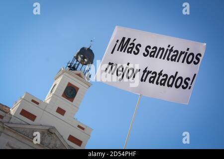 Madrid, Spain. 12th Oct, 2020. A protest placard is seen displayed during the nurse protest in Madrid. Hundreds nurses gather at La Puerta del Sol in the city of Madrid on Spain's National Day to protest against the poor working conditions and cuts in the Spanish healthcare. Credit: SOPA Images Limited/Alamy Live News Stock Photo