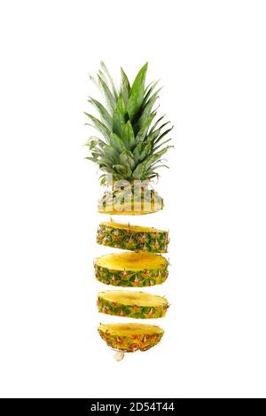 Pineapple fresh ananas. Pineapple sliced, levitates in the air. Concept of summer mood on white background, isolate. Tropical fruit. Stock Photo