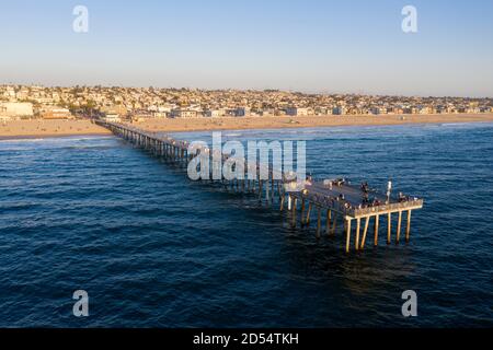 Hermosa Beach pier from the air out over the Pacific Ocean at sunset Stock Photo