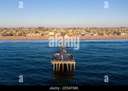 Symmetrical view looking down the pier at Hermosa Beach, California from the air Stock Photo
