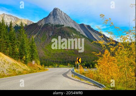 A fall scene along Medicine lake at a sharp corner with Annunciation Peak in the background in Jasper National Park, Alberta Canada.