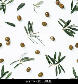 Seamless pattern with green olives and olives tree leaves and branches on white background. Olive photo pattern Stock Photo