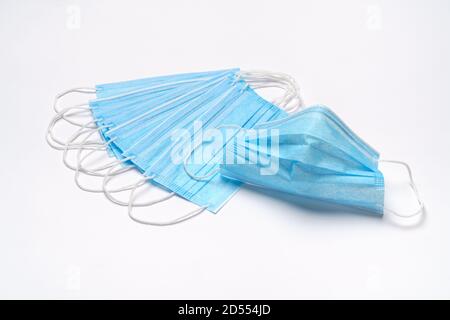 coronavirus COVID-19 pandemic concept - stack of antiviral surgical protective medical mask for protection against corona virus Stock Photo