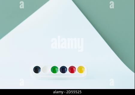new clean palette of watercolors on geometric blue monochrome background, selective focus Stock Photo