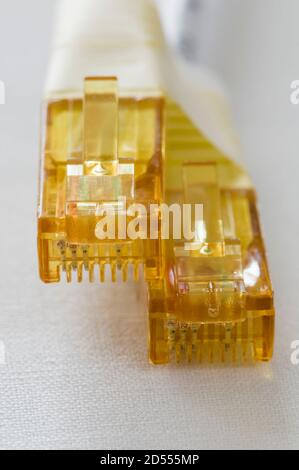 Yellow LAN cable plugs for internet communication Stock Photo
