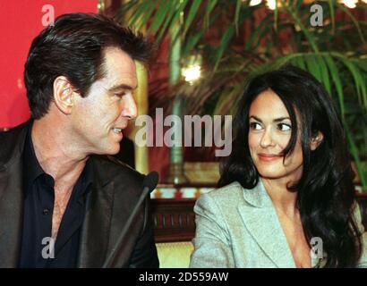Actor Pierce Brosnan looks at Italian actress Maria Grazia Cuccinotta after arriving in Bilbao February 15. Brosnan and Cuccinotta will film in Spain some sequences for the new James Bond film 'The World is not Enough', also starring [Robert Carlyle, Serena Scott Thomas, Denise Richards and Sophie Marceau.]