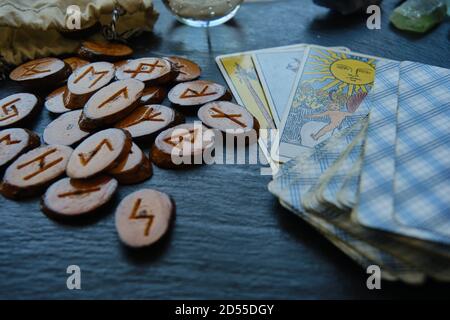 wooden runes from the Tarot card on the table Stock Photo