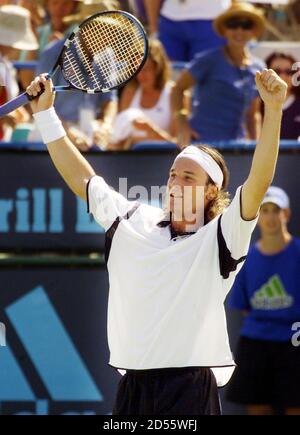Spain's Carlos Moya celebrates his 6-3 1-6 6-1 defeat of [Brazil's Gustavo Kuerten] to take the ATP number one ranking during his semi-final match the Newsweek Champions Cup Tournament in Indian