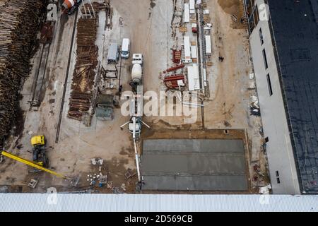 concrete floor filling in an industrial building. Stock Photo