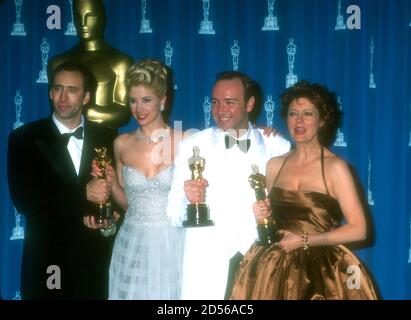 Los Angeles, California, USA 25th March 1996 (L-R) Best Actor Winner Nicolas Cage ('Leaving Las Vegas'), Best Supporting Actress Winner Mira Sorvino ('Mighty Aphrodite'), Best Supporting Actor Winner Kevin Spacey ('The Usual Suspects') and Best Actress Winner Susan Sarandon ('Dead Man Walking:) pose with their Oscars in press room at the 68th Annual Academy Awards at Dorothy Chandler Pavilioin on March 25, 1996 in Los Angeles, California, USA. Photo by Barry King/Alamy Stock Photo Stock Photo