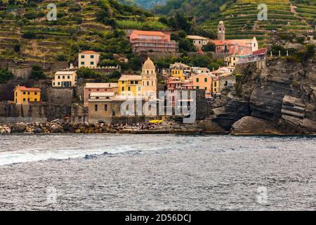 Lovely close-up view of Vernazza in the Cinque Terre coastal area from the sea. Colourful buildings, the Church of Santa Margherita d'Antiochia and...