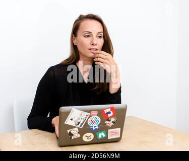 Woman working on a laptop Stock Photo