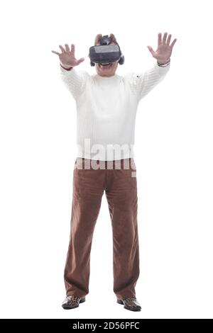 smiling man looking through virtual reality glasses. isolated on a white Stock Photo