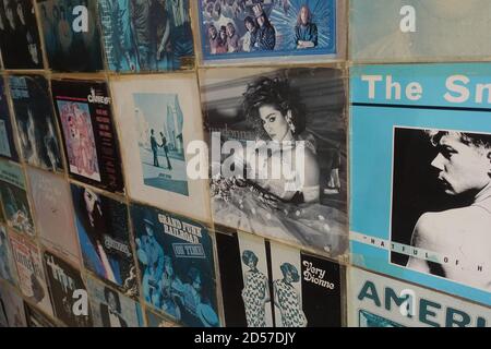 Athens, Greece - August 7, 2019: Wall with vintage pop rock music vinyl record albums from the 1970s and 1980s. Stock Photo