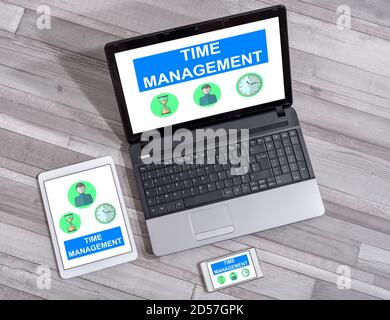 Time management concept shown on different information technology devices Stock Photo