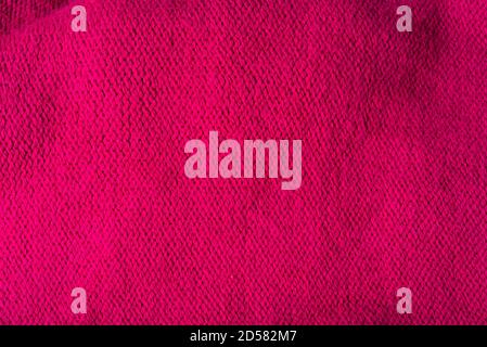 Red woolen texture, bay be used as background. Red fabric texture. Stock Photo