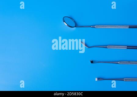 Dentist tools. Teethcare, dental health concept. Blue background top view copy space Stock Photo