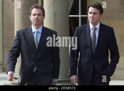 Prime Minister Tony Blair (L) walks alongside Northern Ireland Secretary Peter Mandelson apon his arrival at Hillsborough Castle, County Down, Northern Ireland, April 18. Blair, who flew in on a one-day visit, will hold talks with both Roman Catholic and Protestant party leaders to assess the current logjam in the peace pact he helped launch two years ago.  PM