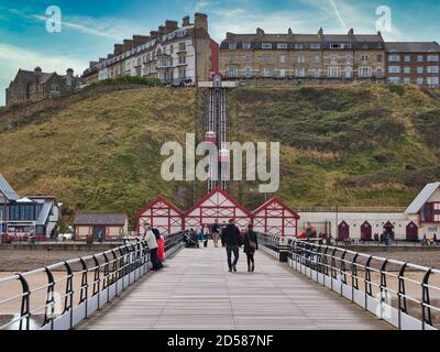 From the end of the Grade 2 listed pier at Saltburn-by-the-Sea, looking back to the Saltburn Cliff Lift funicular cliff railway Stock Photo