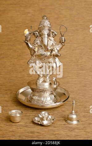 Silver idol of Lord Ganesha. Dancing Ganesh. Indoor studio shot. Stock Photo