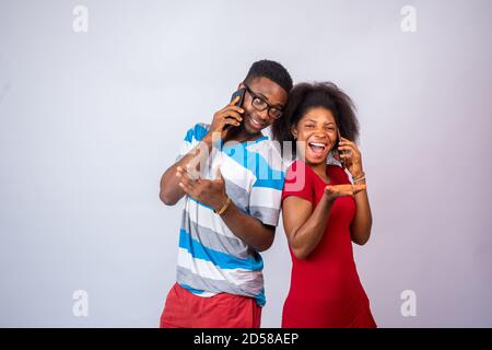 excited young african people making phone calls Stock Photo