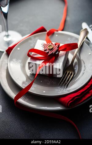 Gift box on a place setting at Christmas Stock Photo